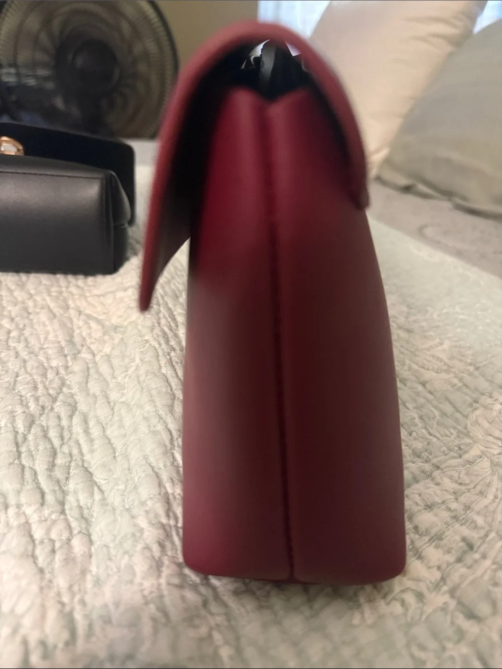 Source Unknown sleek burgundy